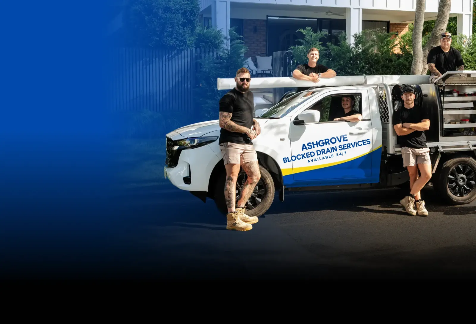 Ashgrove Blocked Drain Services team with the ute